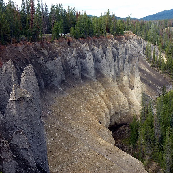 The Pinnacles are a group of volcanic pumice spires, colored various shades of grey and brown near Crater Lake National Park.