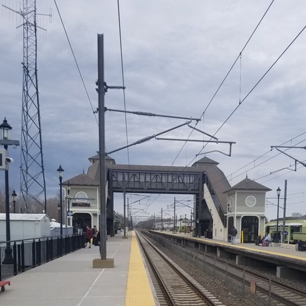 The station features a distinctive island platform, which is relatively unusual for Amtrak stations. Passengers can access the platform via a charming pedestrian bridge.