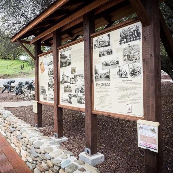 Interpretive signage throughout the park explains mining methods, equipment functions, and daily life for miners.