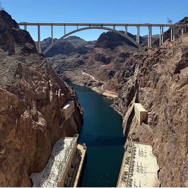 Nearby, the Mike O'Callaghan–Pat Tillman Memorial Bridge spans the canyon, offering a higher vantage point and panoramic views of the dam from above.