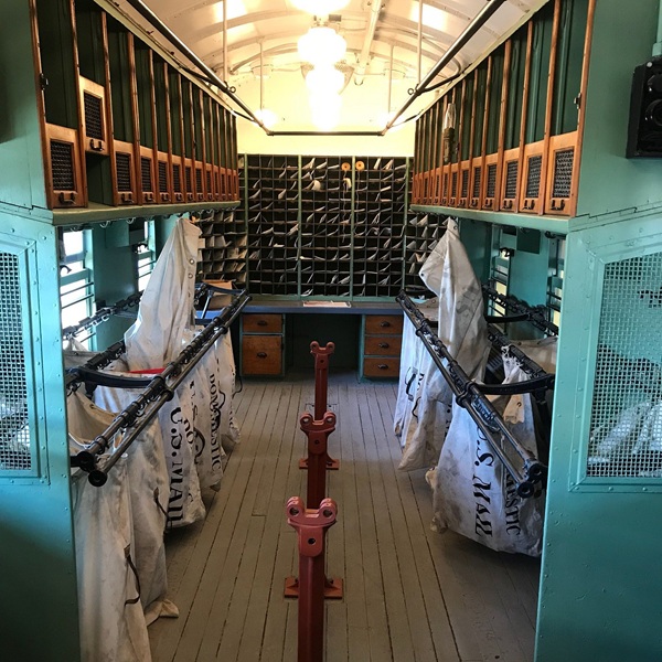 The museum includes both indoor exhibits and an outdoor rail yard where visitors can walk among historic railcars and engines.
