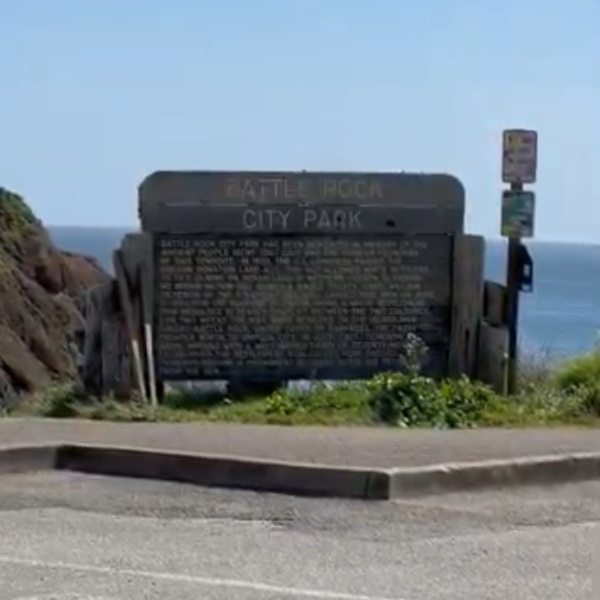 Battle Rock offers sweeping ocean views, beach access, tidepool exploration, and interpretive signs explaining the area’s history. 