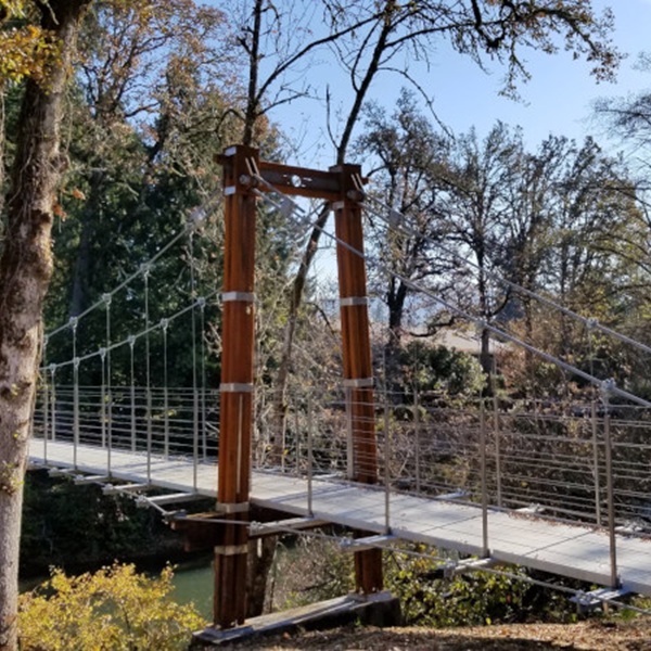Established in 1900, the J. Polk Currin Swinging Bridge, located near Prospector Park, is a historic pedestrian suspension bridge spanning the Coast Fork of the Willamette River. 