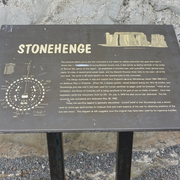 Informational plaques provide historical context about the construction of the memorial and its dedication to the fallen soldiers. 