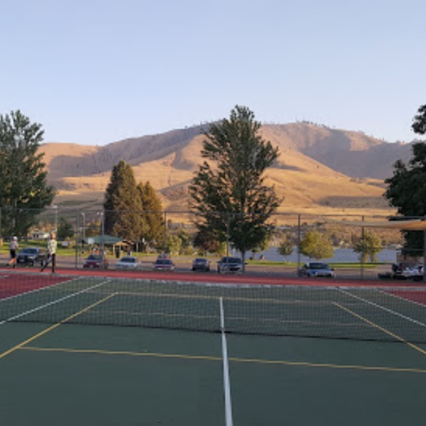 Don Morse Memorial Park features tennis courts set against the stunning backdrop of Lake Chelan and the surrounding mountains, offering a picturesque setting for playing tennis. 