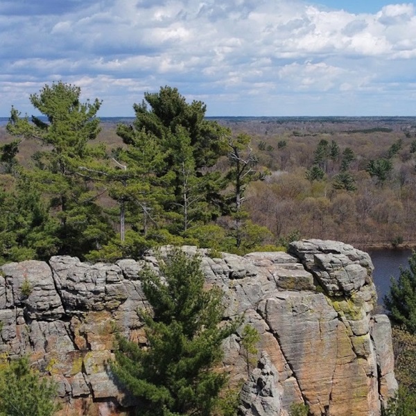 The sandstone cliffs offer excellent climbing texture, with cracks, faces, and overhangs. 