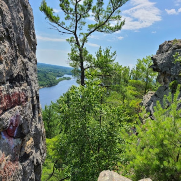 Petenwell Bluff overlooks Petenwell Lake, providing climbers with breathtaking views of the water and surrounding forests. 