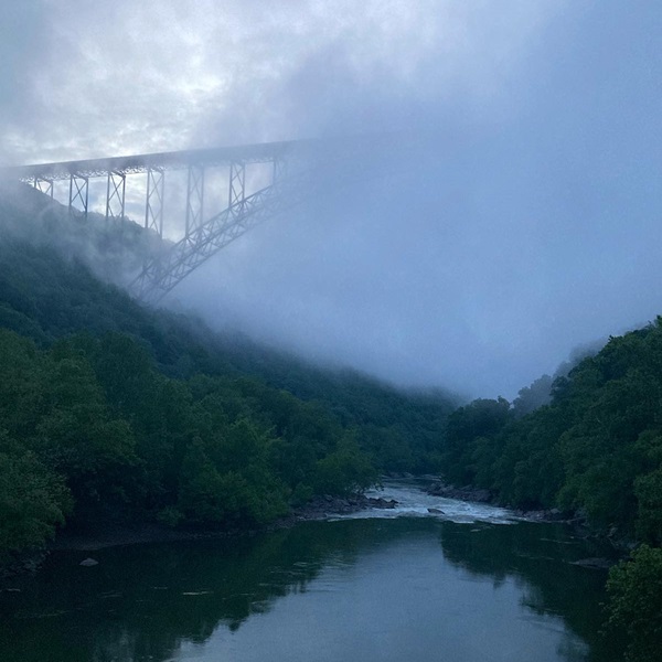 New River Gorge Bridge is one of the longest steel span bridges in the Western Hemisphere and a major landmark, offering stunning views of the gorge below. 