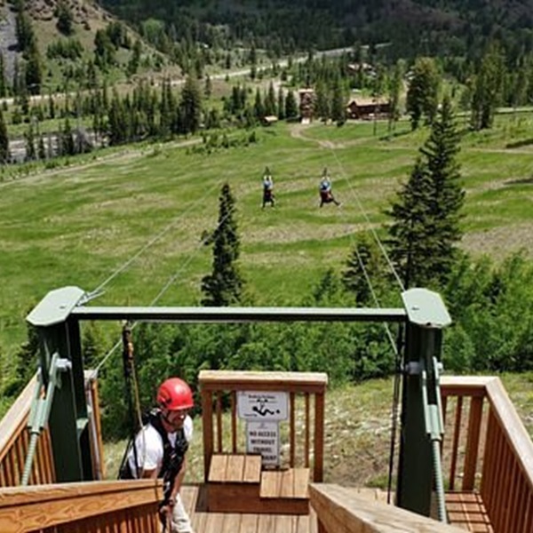 Riders enjoy panoramic vistas of the rugged Wyoming landscape, including the Shoshone National Forest and the nearby Absaroka Range. 