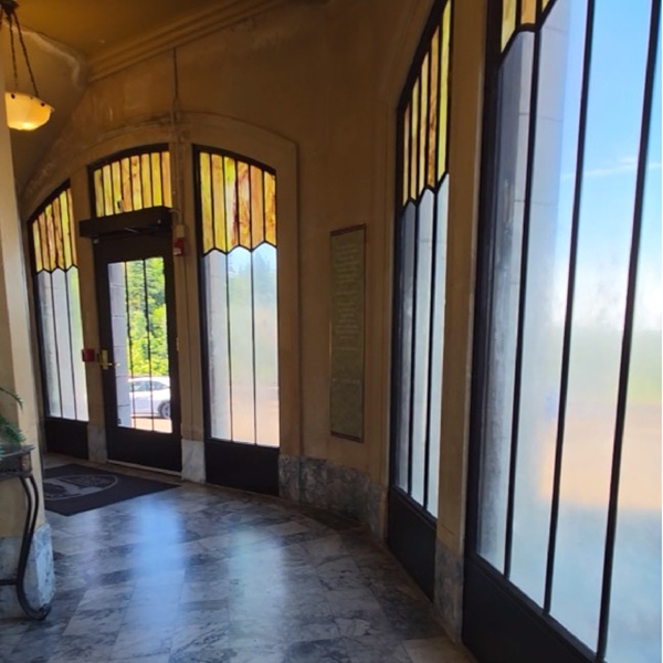 The building features marble floors made from Alaskan Tokeen Marble and Kasota limestone, and the decorative opalescent stained-glass windows allow natural light to fill the interior.