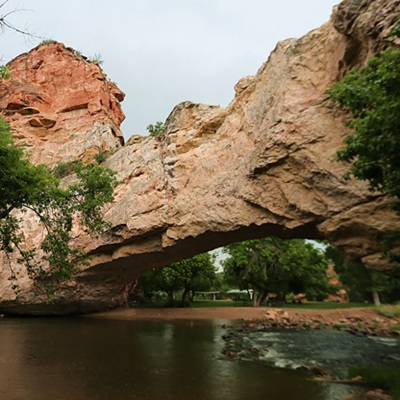 Ayres Natural Bridge Park, located near Glenrock, features a rare natural rock bridge with a creek flowing underneath, a unique geological and scenic site.  