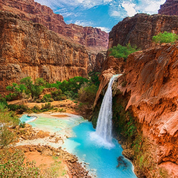 Picturesque Havasu Falls on the Havasupai (“people of the blue-green water”) Tribal lands. Tent camping near the falls is accessed by permit only, obtained through the Havasupai Tribe’s Tourism Office. 