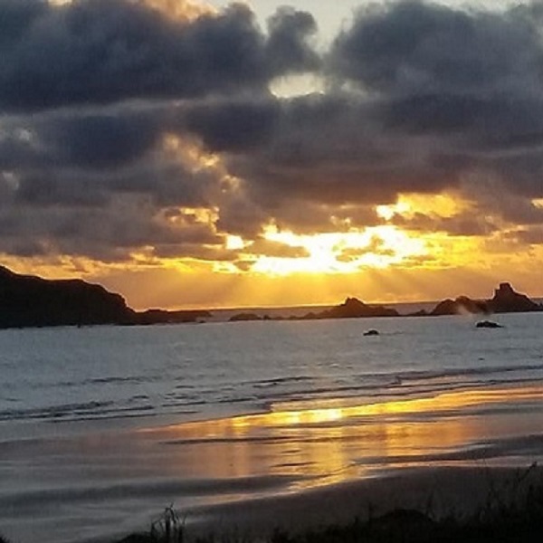 Sunset on Pebble Beach looking towards Point St. George Lighthouse. 