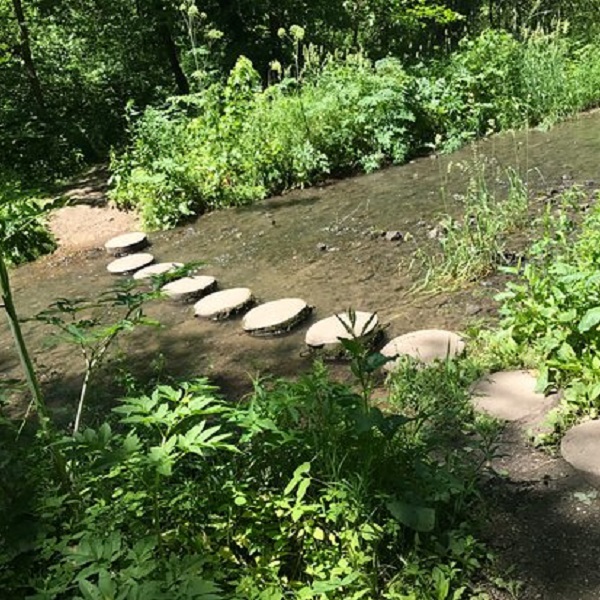Concrete stepping stones allow visitors to cross streams in the park. 