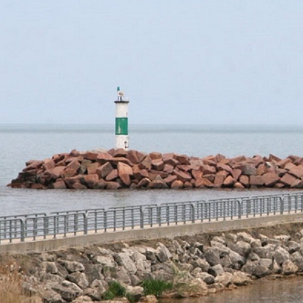 The lighthouse near Portage Lakefront and Riverwalk marks the entrance to the Port of Indiana, which bisects the National Park. 