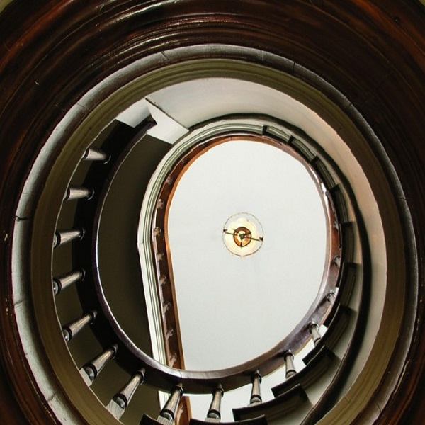 A spiral staircase leads to the oversized cupola that adorns the home. 