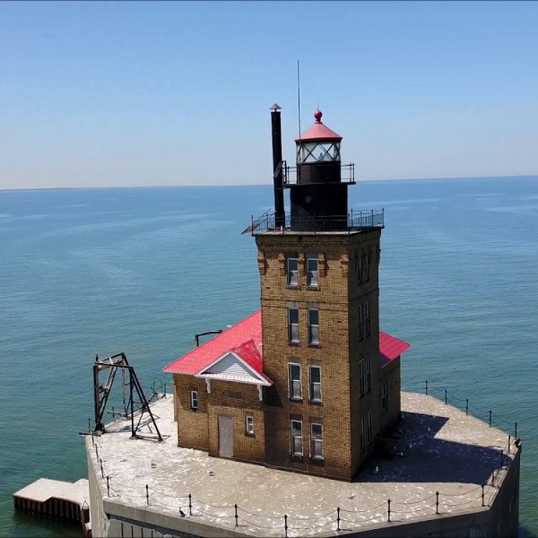 The Port Austin Lighthouse sits at the opposite end of the reef as the Pointe aux Barques Lighthouse does.