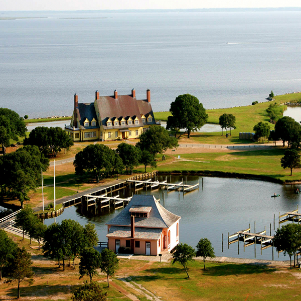 The beauty of the Outer Banks drew the wealthy to build their estates, including the Historic Whalehead Club, now a museum.