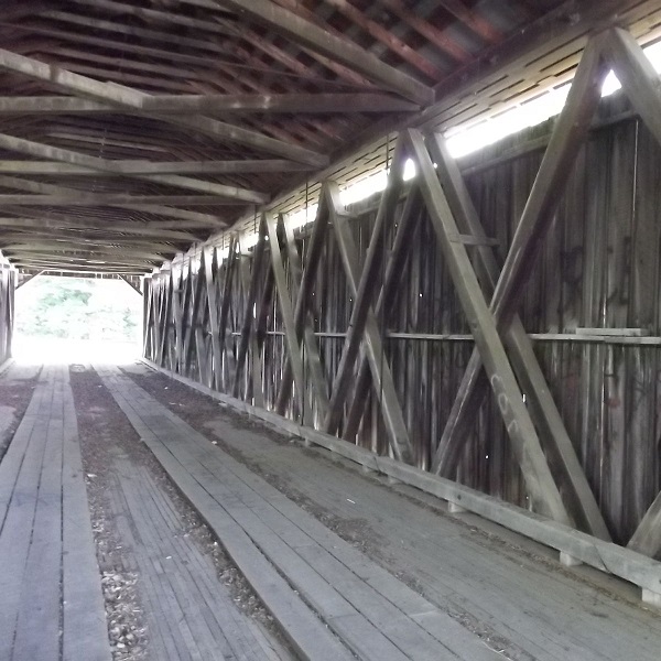The Brown Covered Bridge is a covered Smith through truss, built by the Smith Bridge Company of Toledo in 1880. 