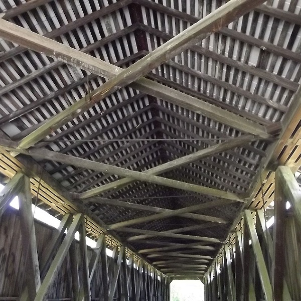 The North Pole Covered Bridge is a covered Howe truss design, originally built in 1865. 