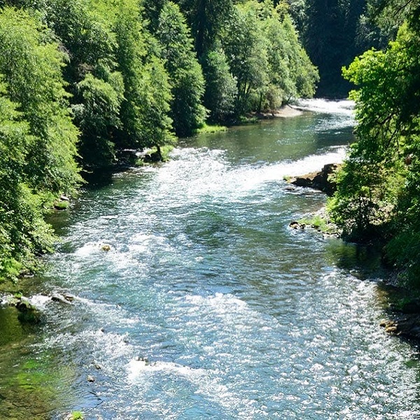 The lighthouse is at the confluence of the Umpqua River at the Pacific Ocean.