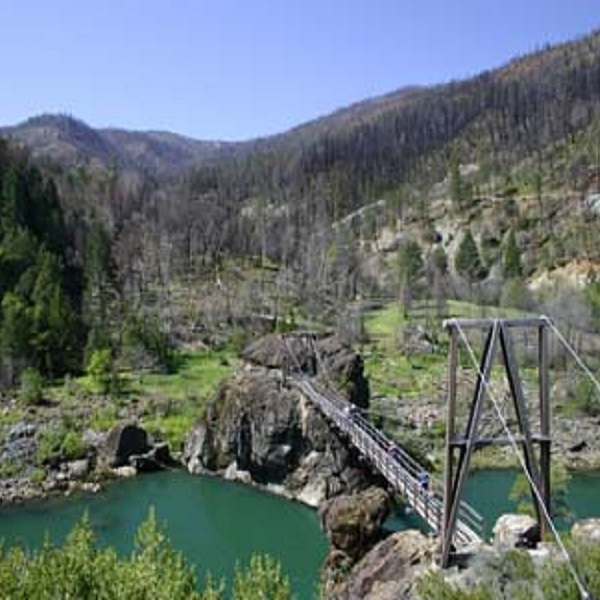 The well-known wooden walkway crosses the Illinois River. 