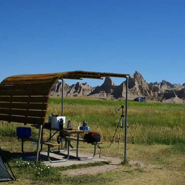 Some campsites include shaded picnic tables. 