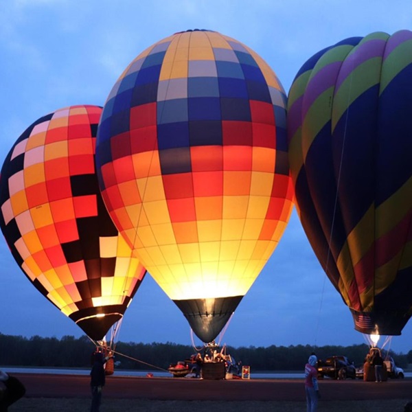 With over 40 balloons participating, the festival paints the Ozark sky with vibrant hues, transforming the landscape into a whimsical scene. 