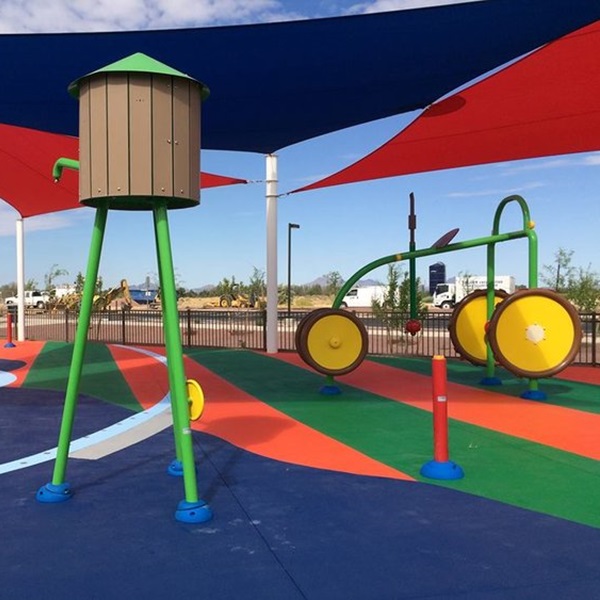 The Splash Park features a farm-themed design with a water windmill, tractor, and spraying horses. 