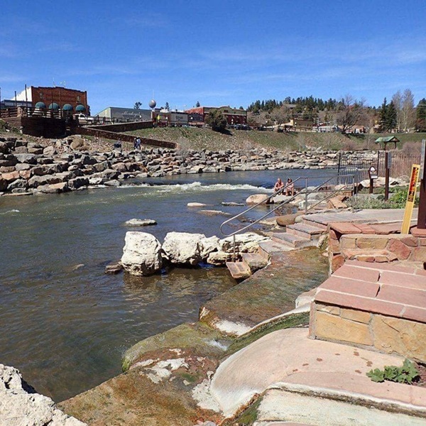 The Southern Ute Indian Tribe, known as the "mountain people," were the original inhabitants of the area and called the bubbling spring "Paqhosa," meaning "healing waters." 