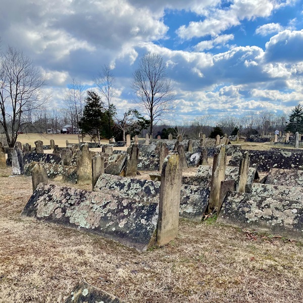 The best known of the headstones is one that has three masks. This headstone marks the burial site of Isaac Nettles’ wife, Korean, who died in 1933. 
