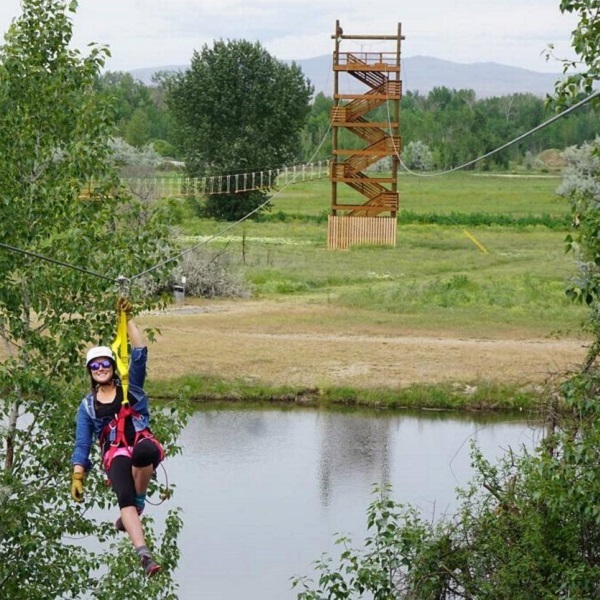 Adventurous visitors can sail over the Boise River on the park's newest zipline attraction.