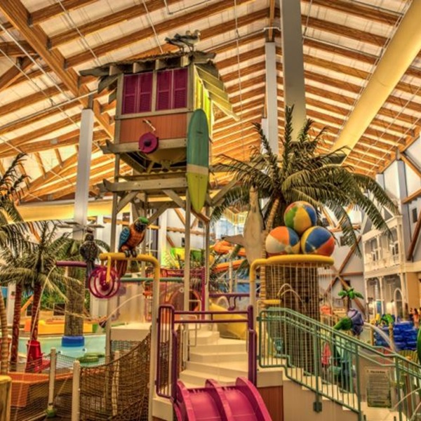Entering Parrot Cove is like entering a tropical paradise, with lush greenery, vibrant murals, and cascading waterfalls. 