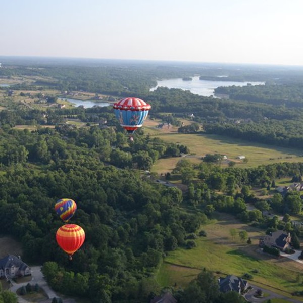 Riders are witness to stunning panoramic views of lakes, woodlands, and the charming town of Wixom from a unique perspective. 