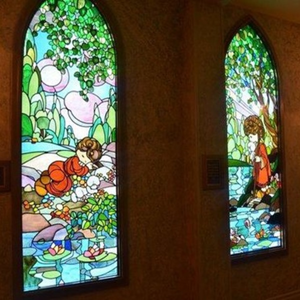 The windows were designed by Sam Butcher, the creator of Precious Moments, and were fabricated by the Cummings Stained Glass Studio in St. Louis, Missouri. 