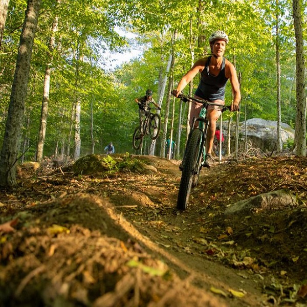 Saranac Lake is a hub for cycling, with long straightaways through farm country, twisting backroads that wind and dip through lush forests, and lakes and valleys ringed by mountains.