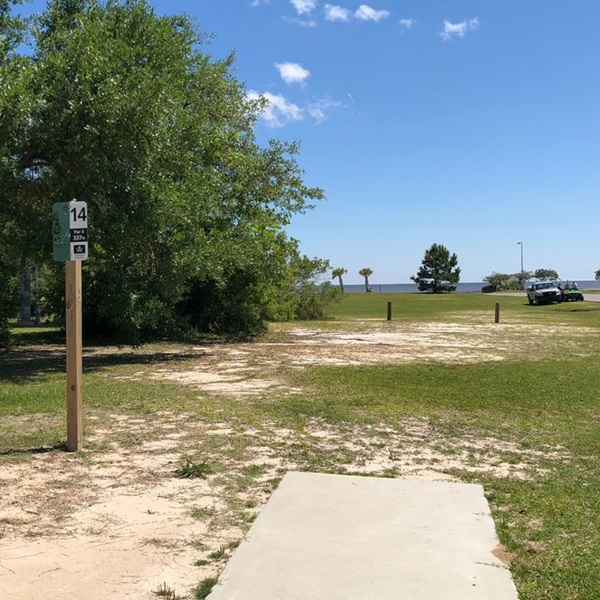 The park's picturesque setting, with its lush forests, marshlands, and waterfront views, provides a stunning backdrop for a round of disc golf. 