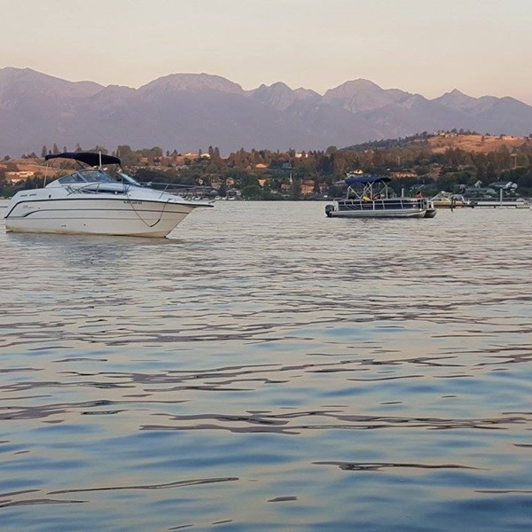 Anglers can launch their boats and explore the lake's expansive waters, accessing prime fishing spots and enjoying scenic views of the surrounding mountains. 