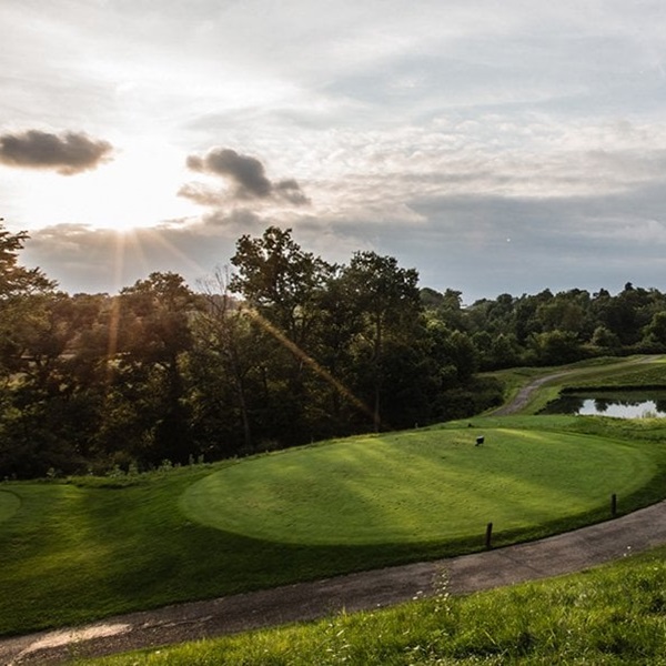 The course is notable for its aesthetic appeal, with features such as meandering streams, shining ponds, and stately white oak trees. 