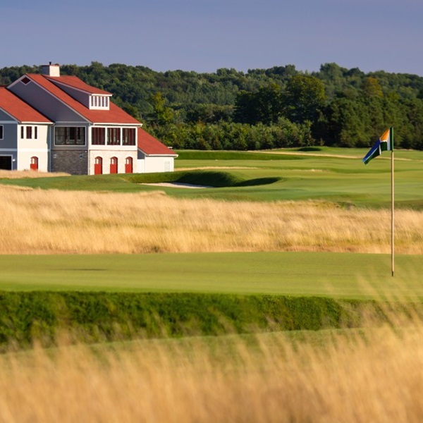Golfers can expect a challenging game influenced by the natural topography and the prevailing winds off Lake Michigan. 