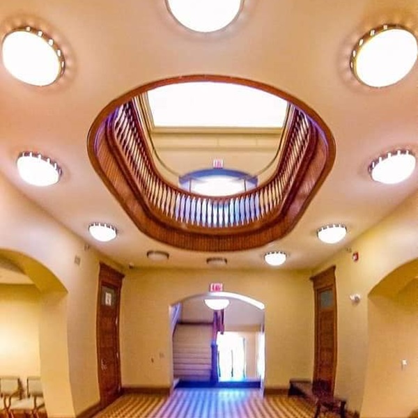 Inside, visitors can admire the building's historic details, including original woodwork, mosaic tile floors, and stained glass windows. 