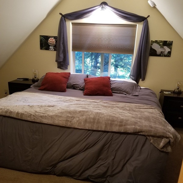 The cabins are designed with a rustic, Alaskan charm, featuring wood interiors and decor that reflect the local environment. 