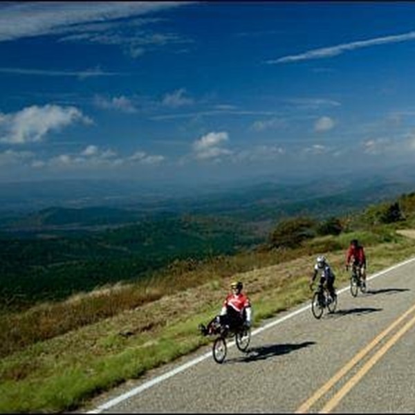The Talimena Scenic Drive is a 54-mile National Scenic Byway that begins in Mena and runs along the ridge of the Ouachita Mountains, offering breathtaking views. 