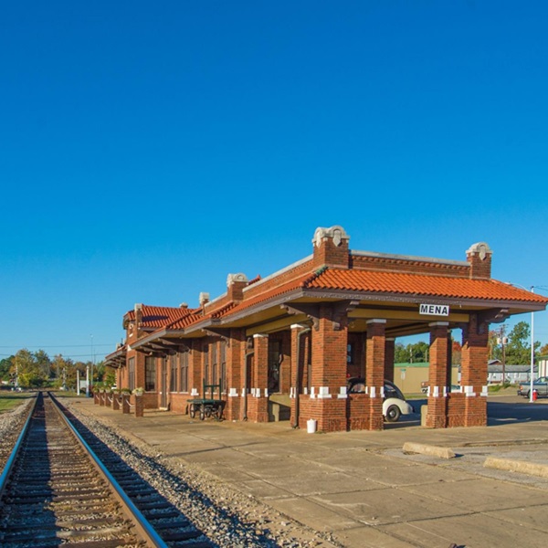 The Historic Mena Depot is a restored train depot that now serves as the Mena Visitor Center and a local museum, showcasing the town’s history and railroad heritage. 