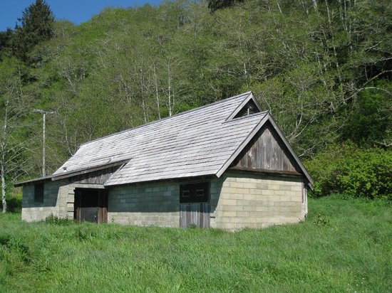The site features two original structures – the radar operations building and a power generation building – both camouflaged to look like a farmhouse and barn. 
