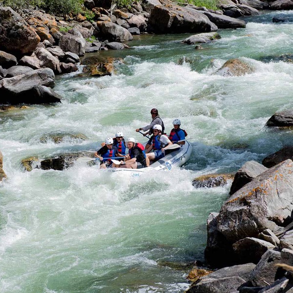 Paddlers can experience the adrenaline rush of navigating through whitewater rapids under the guidance of experienced river guides. 