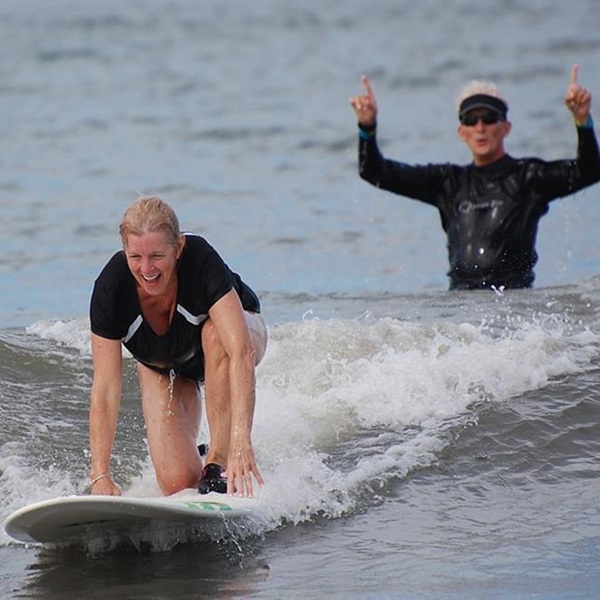 The gentle surf is forgiving, making it an excellent location for surf lessons and those new to the sport. 