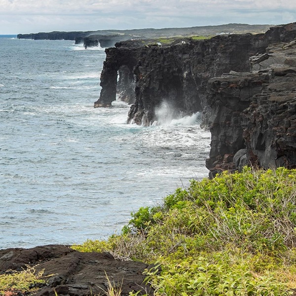 The climbing routes are set against the backdrop of the Pacific Ocean, offering stunning views and dramatic scenery. 