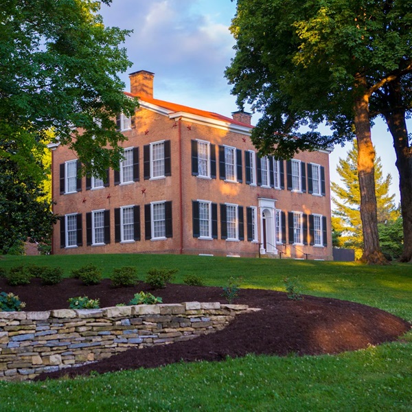 Visitors can explore My Old Kentucky Home State Park, which features the historic Federal-style mansion that inspired Stephen Foster's famous song. 