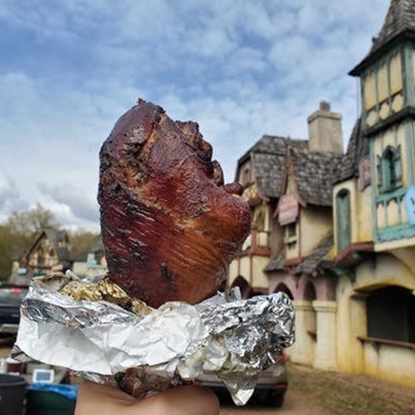 Visitors can indulge in a variety of hearty fare such as turkey legs, meat pies, and roasted nuts, as well as sweet treats like pastries and mead, and traditional beverages such as ale, cider, and mulled wine. 